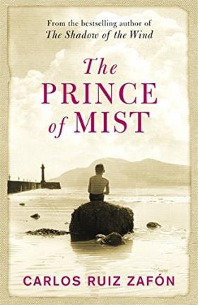 The Prince of Mist book cover of a kid sitting on a rock looking out to sea.