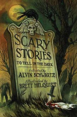 Scary Stories to Tell in the Dark book cover. The title of the book, and the author's name have been engraved on a headstone. 